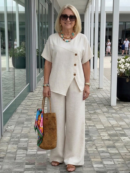 Dames lente/zomer nieuwe modieuze casual set, linnen asymmetrische knopdecoratieve top, tweedelige broek met wijde pijpen